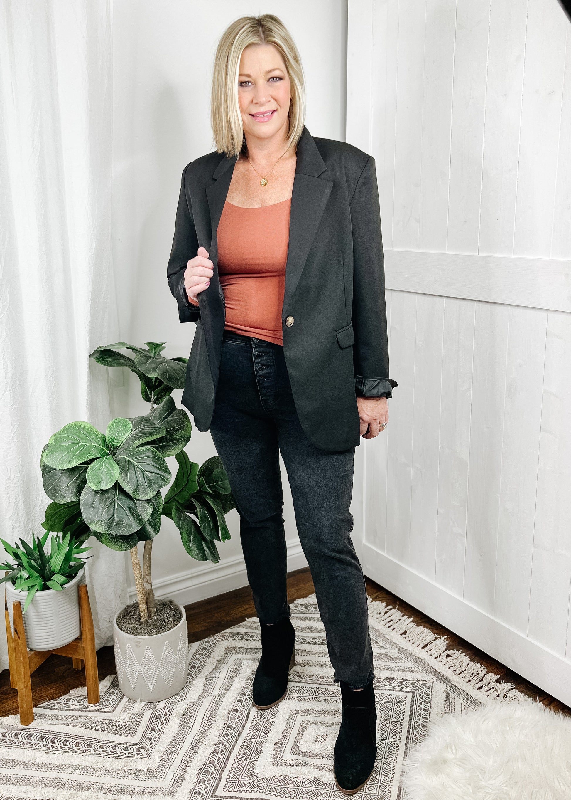 black blazer - ovetsized black blazer with the classic style, one button closure, side pocketd, button a wrist and collar. Shown with our Square Neck Top