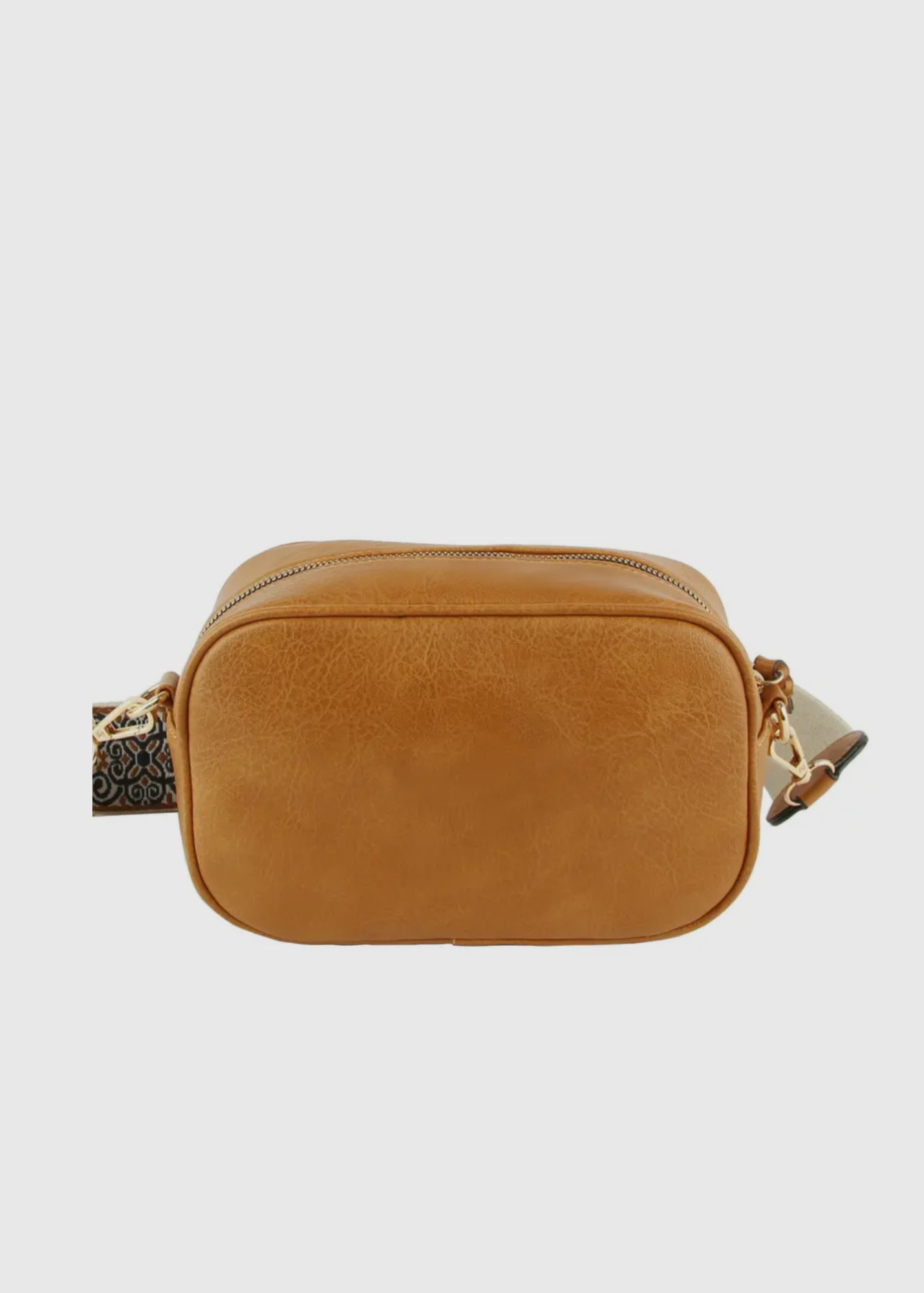 Vegan leather boho style  purse with detailed guitar strap. Purse has a zip closure, back zip pocket, gold tone hardware and detachable strap.
8.5 x 5.5 x 3”. Shown in brown.