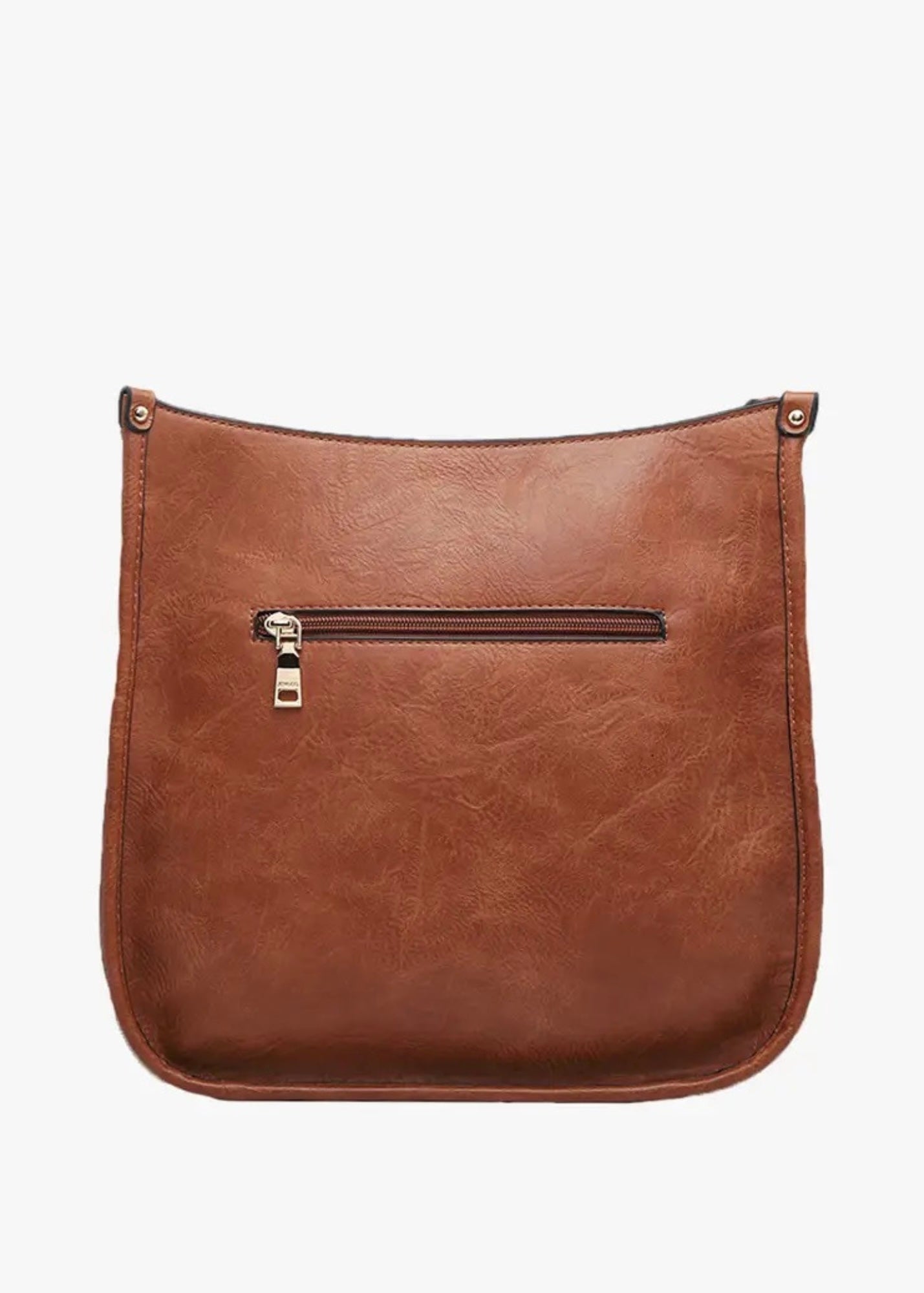 Vegan leather crossbody purse with adjustable black guitar strap. Front has a snap slip pocket, top zip closure to keep your belongings secure.  Dimensions of 10x10x2.5 inches. Shown in brown.