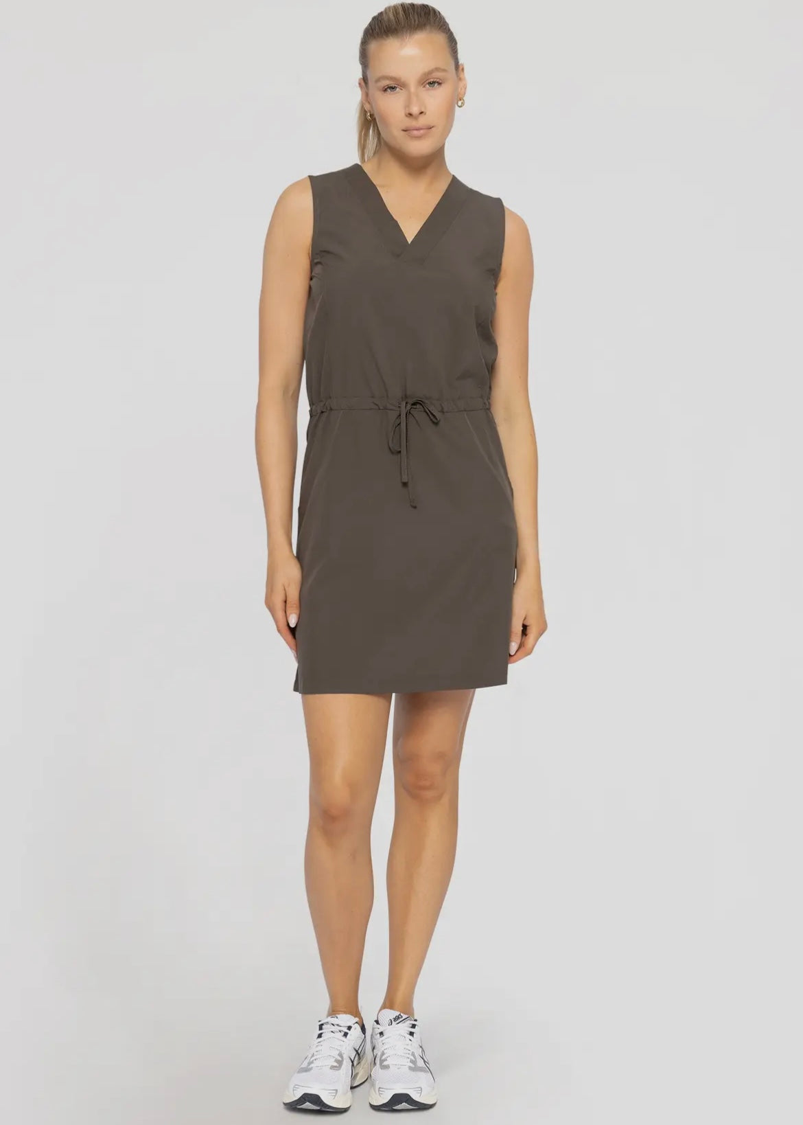 Active dress in a dark olive.  Tank top style with v-neckline, functional drawstring at waist and side pockets.  Dress is approximately 4-5 inches above the knee.