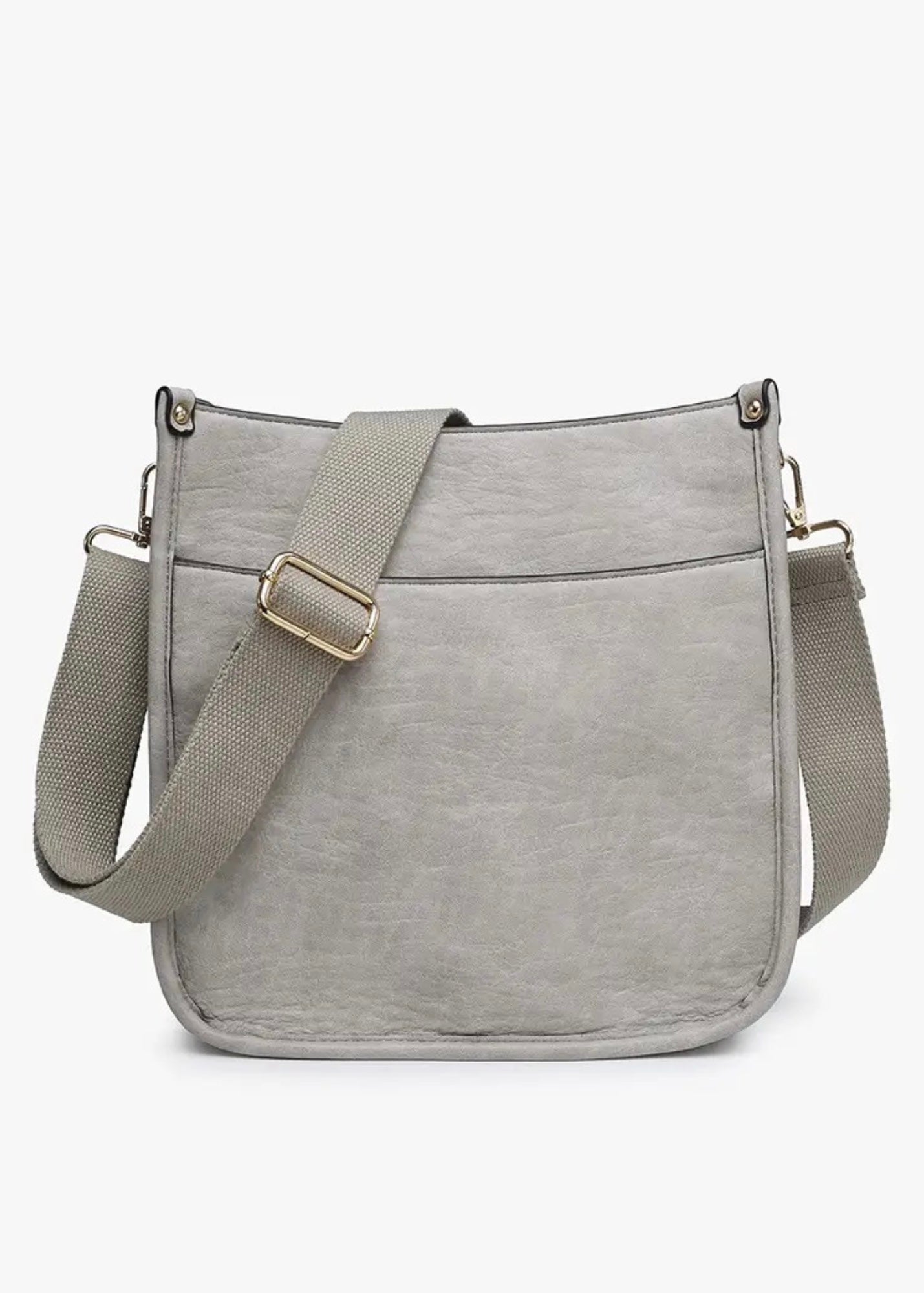 Vegan leather crossbody purse with adjustable black guitar strap. Front has a snap slip pocket, top zip closure to keep your belongings secure.  Dimensions of 10x10x2.5 inches. Shown in light gray.