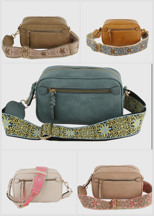Vegan leather boho style  purse with detailed guitar strap. Purse has a zip closure, back zip pocket, gold tone hardware and detachable strap.
8.5 x 5.5 x 3”