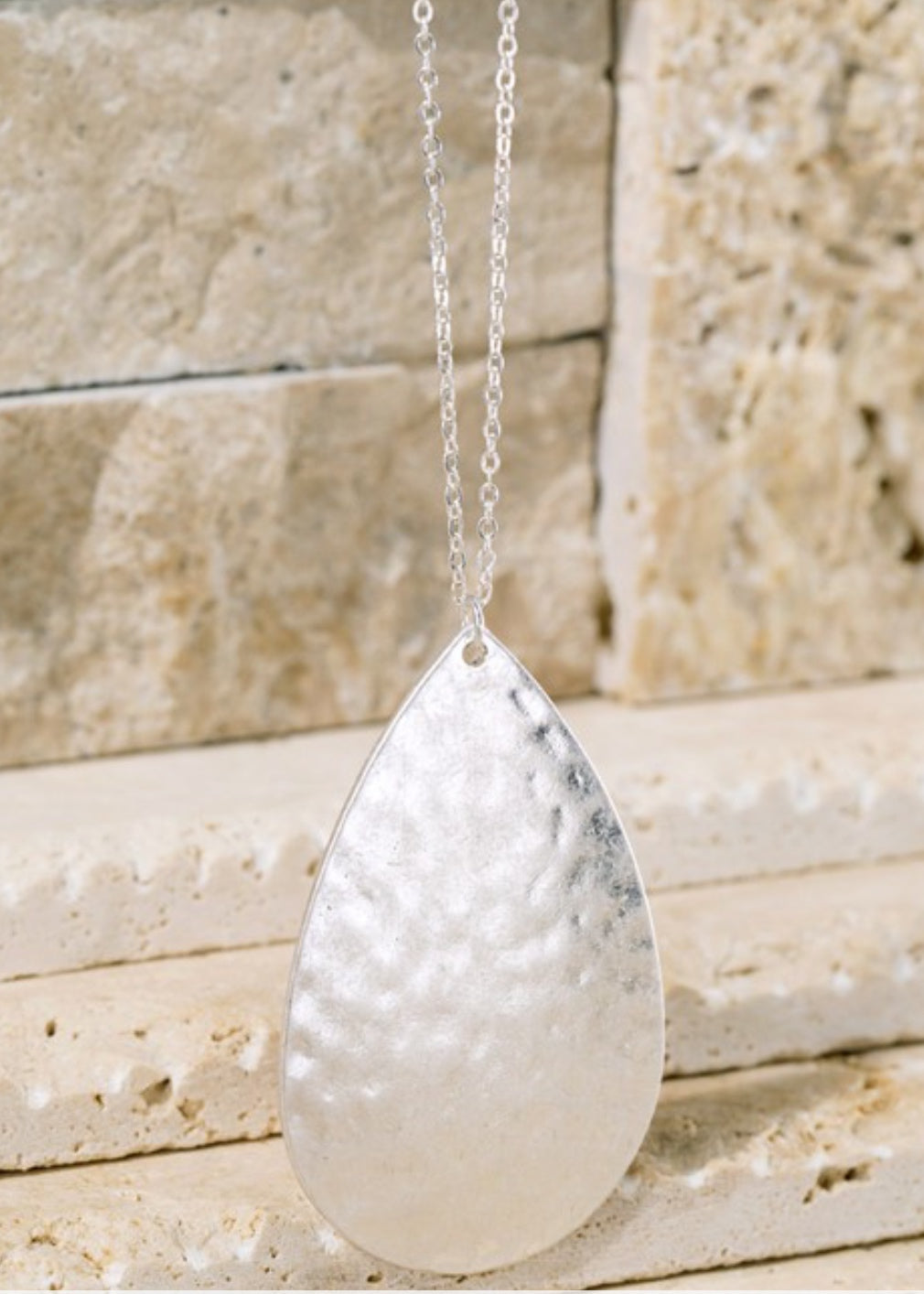 Silver teardrop necklace.