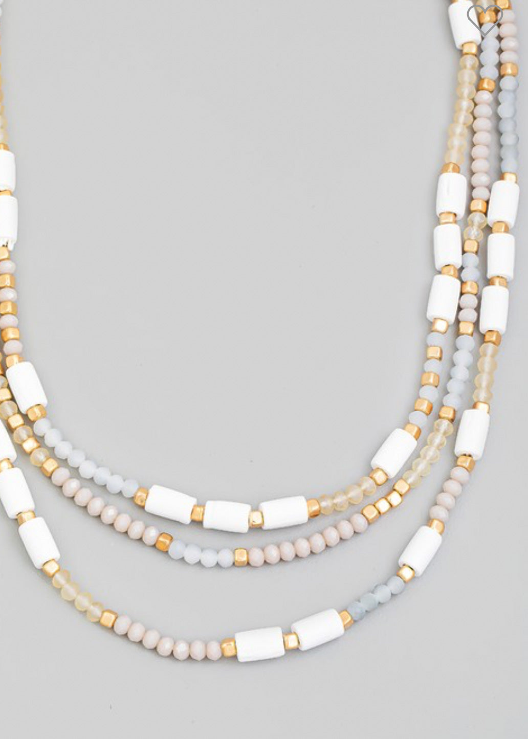 Beaded necklace with multi beads in small rounded frost and gold beads with larger white beads sporadically throughout