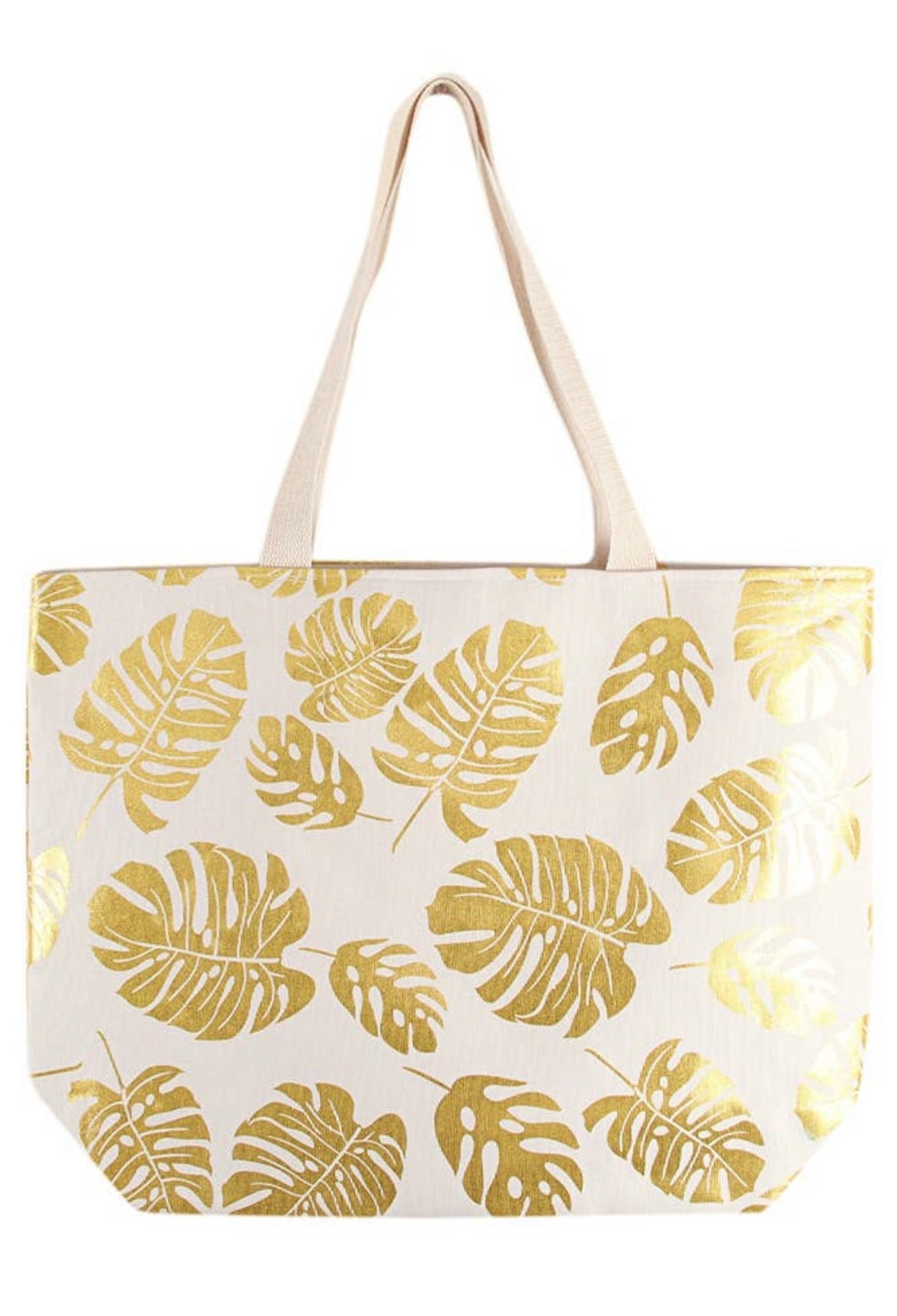 Cream beach bag with gold foil tropical leaves imprinted  throughout.  Bag has a snap closure and long straps. 