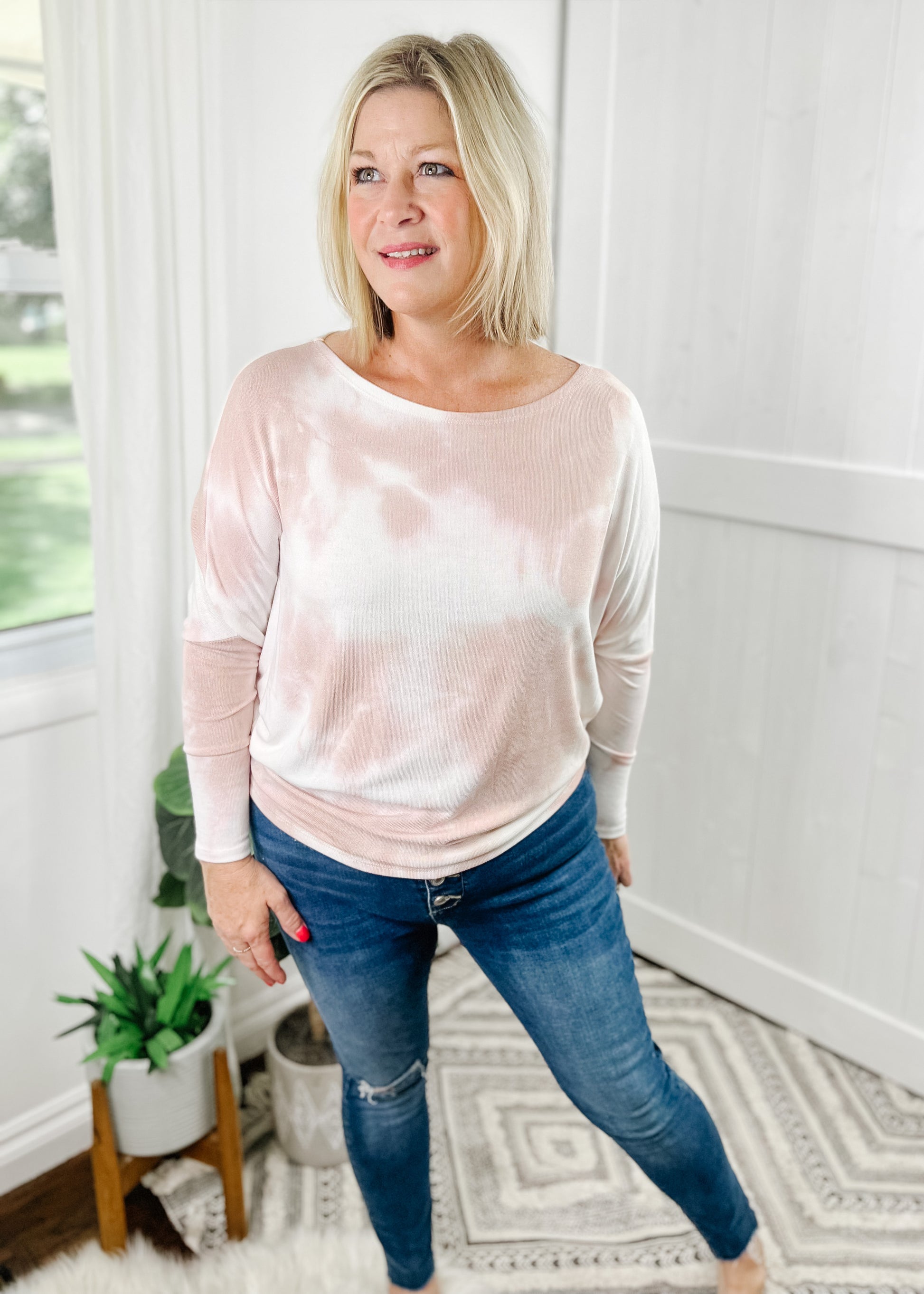 pink and cream tie dye dolman top in a light and soft fabric, boat neck, dolman sleeve fit tapers below waist for a flattering fit. 