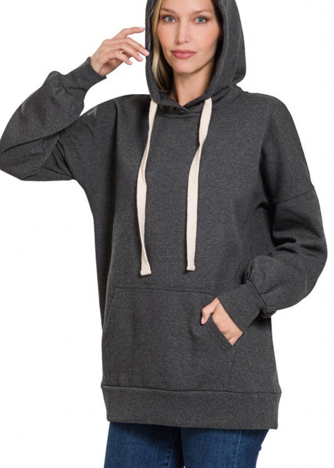 Oversized hoodie sweatshirt with kangaroo front pocket and cream drawstrings. Shown in charcoal