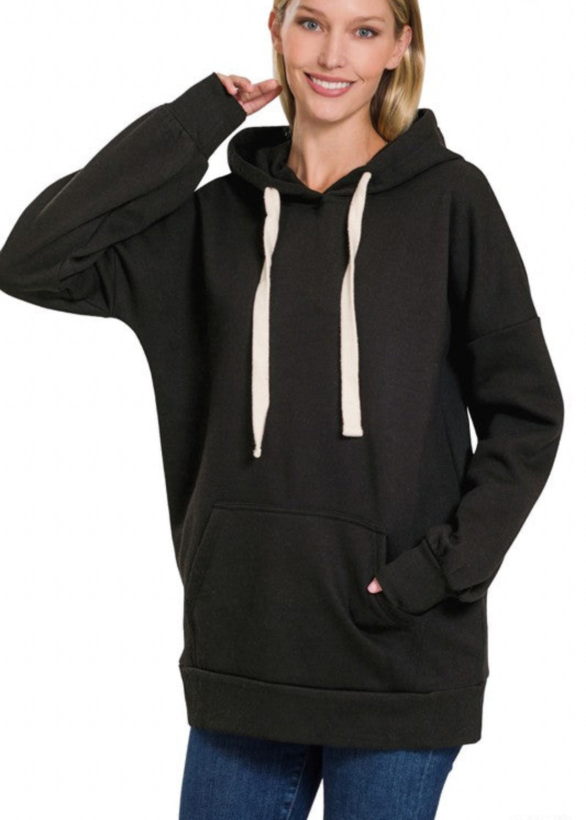 Oversized hoodie sweatshirt with kangaroo front pocket and cream drawstrings. Shown in black