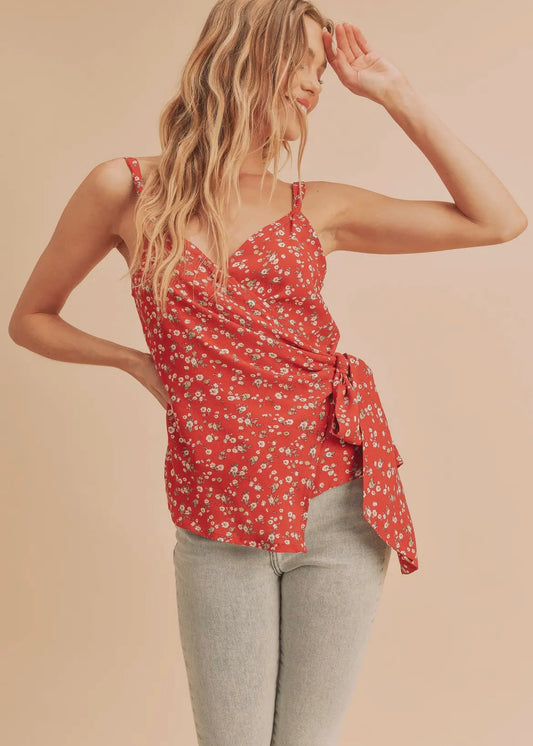 Red floral wrap tank top with thin straps and crossover front that ties on the side.  