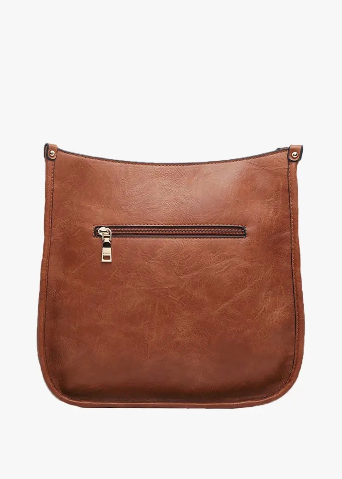 Vegan leather crossbody purse with adjustable black guitar strap. Front has a snap slip pocket, top zip closure to keep your belongings secure.  Dimensions of 10x10x2.5 inches. Shown in brown. 