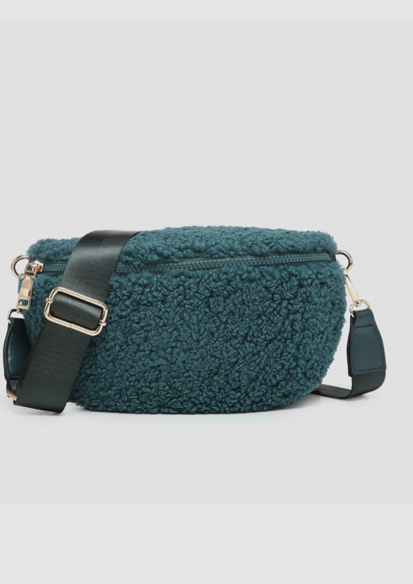 Sherpa belt bag in a pretty green peacock with adjustable guitar strap, front zip closure, back zip pocket, inner zip pocket and card slot. 