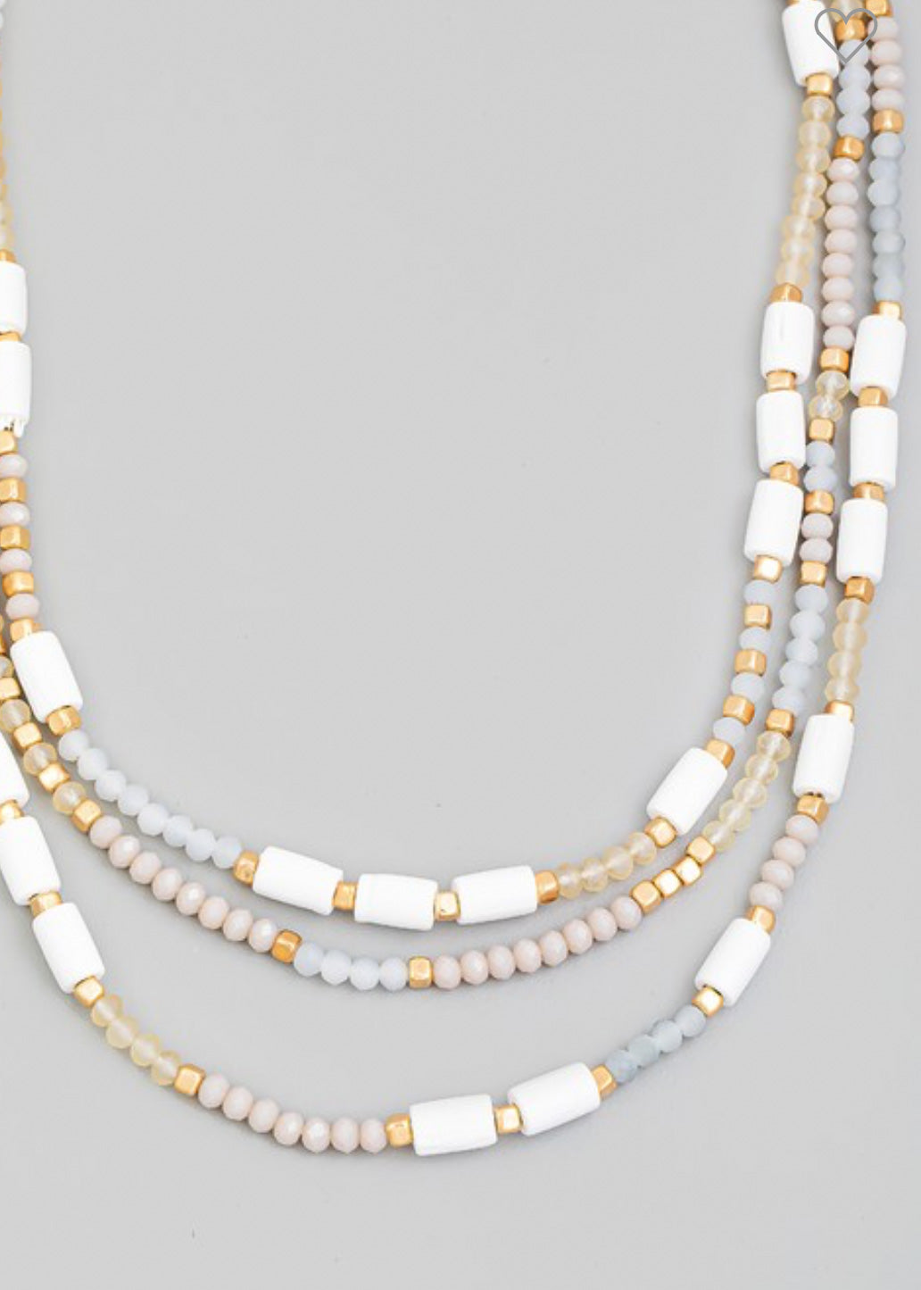 Beaded necklace with multi beads in small rounded frost and gold beads with larger white beads sporadically throughout 