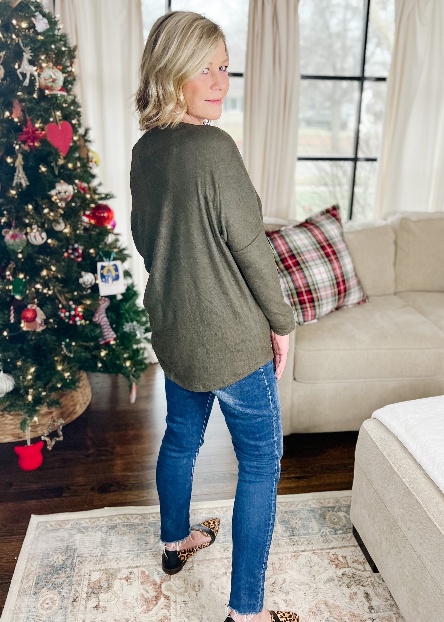 Soft brushed top that can be worn on or off the shoulder, tunic length, sl I'm fitted sleeves with drop shoulder. Available in ruby and olive.