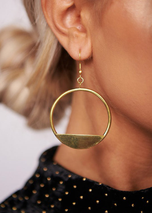 Antique gold colors hoop earrings with half hoop filled with solid brass iron metal. Approximately 2.75” 
