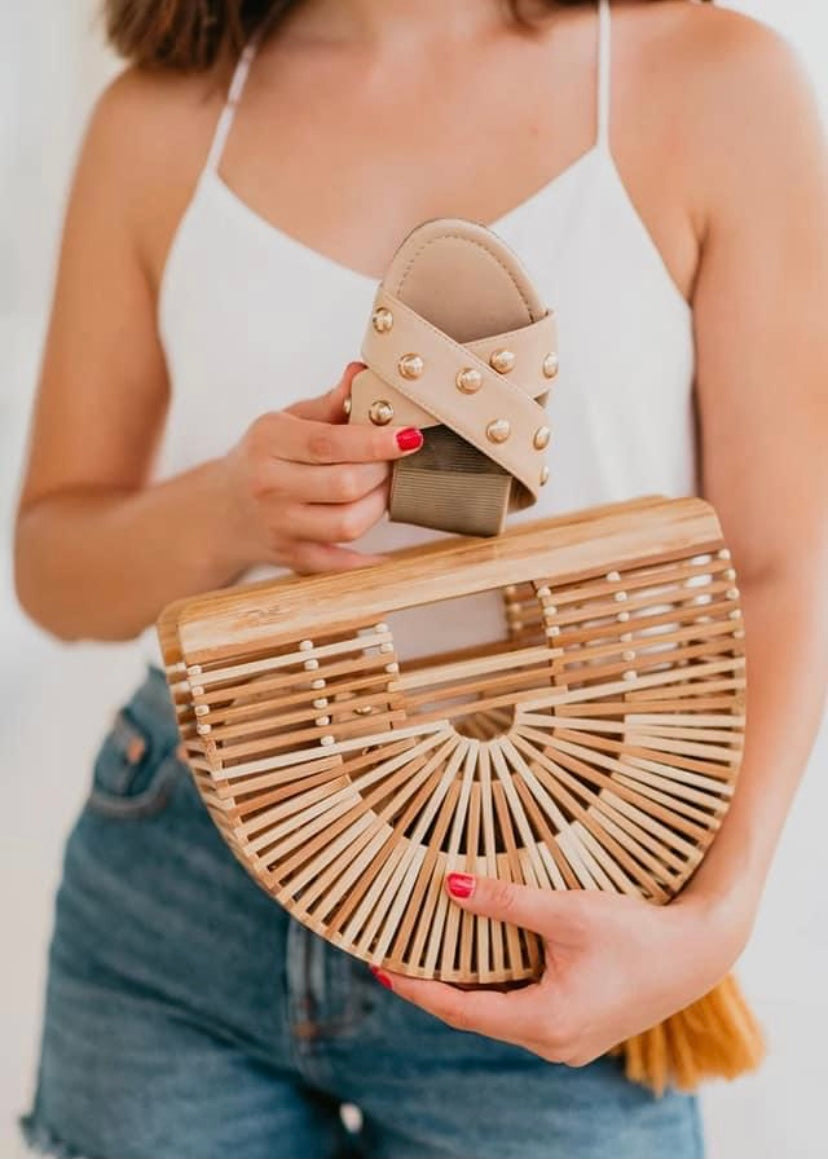 Rollasole Tan flexible slip on sandals with cross cross design and gold studs.