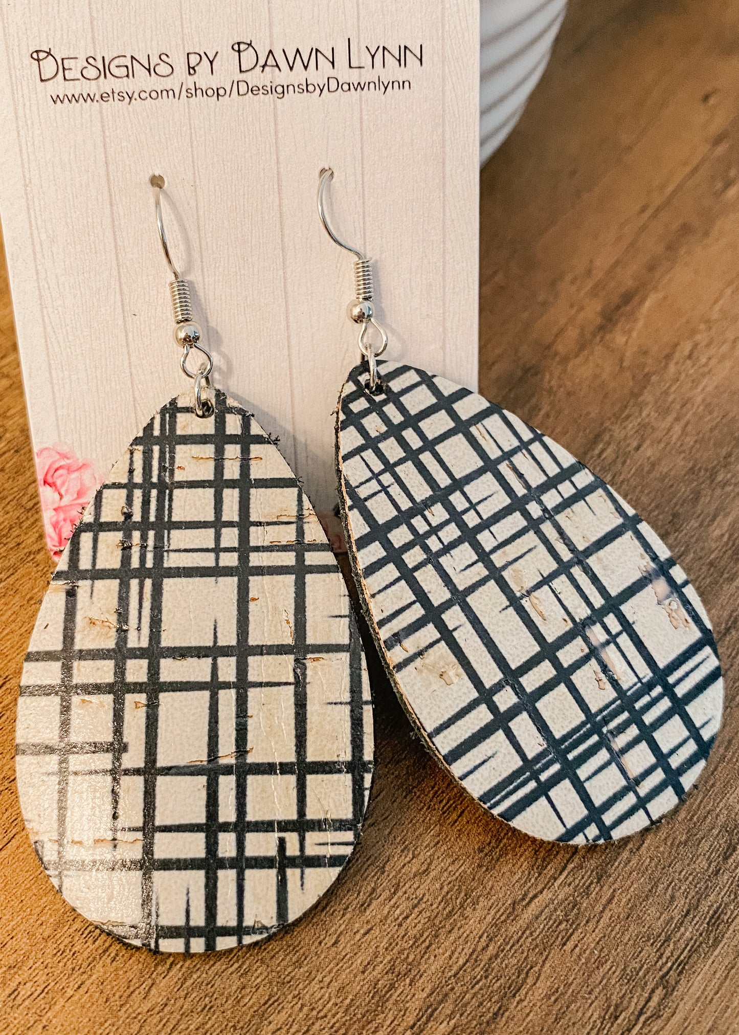 Black and cream Genuine leather teardrop earrings in a sketched plaid pattern.