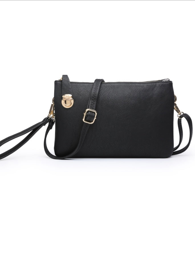 Black Crossbody/Clutch in a soft vegan leather, top zip closure, gold tone hardware, wrist strap and detachable long shoulder strap (included) and top lock closure. Dimension 12” L x 1” D x 8” H