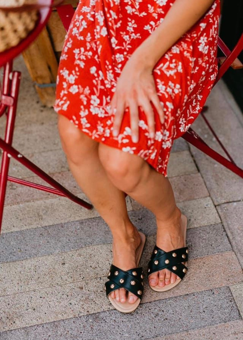 Rollasole Tan flexible slip on sandals with cross cross design and gold studs.